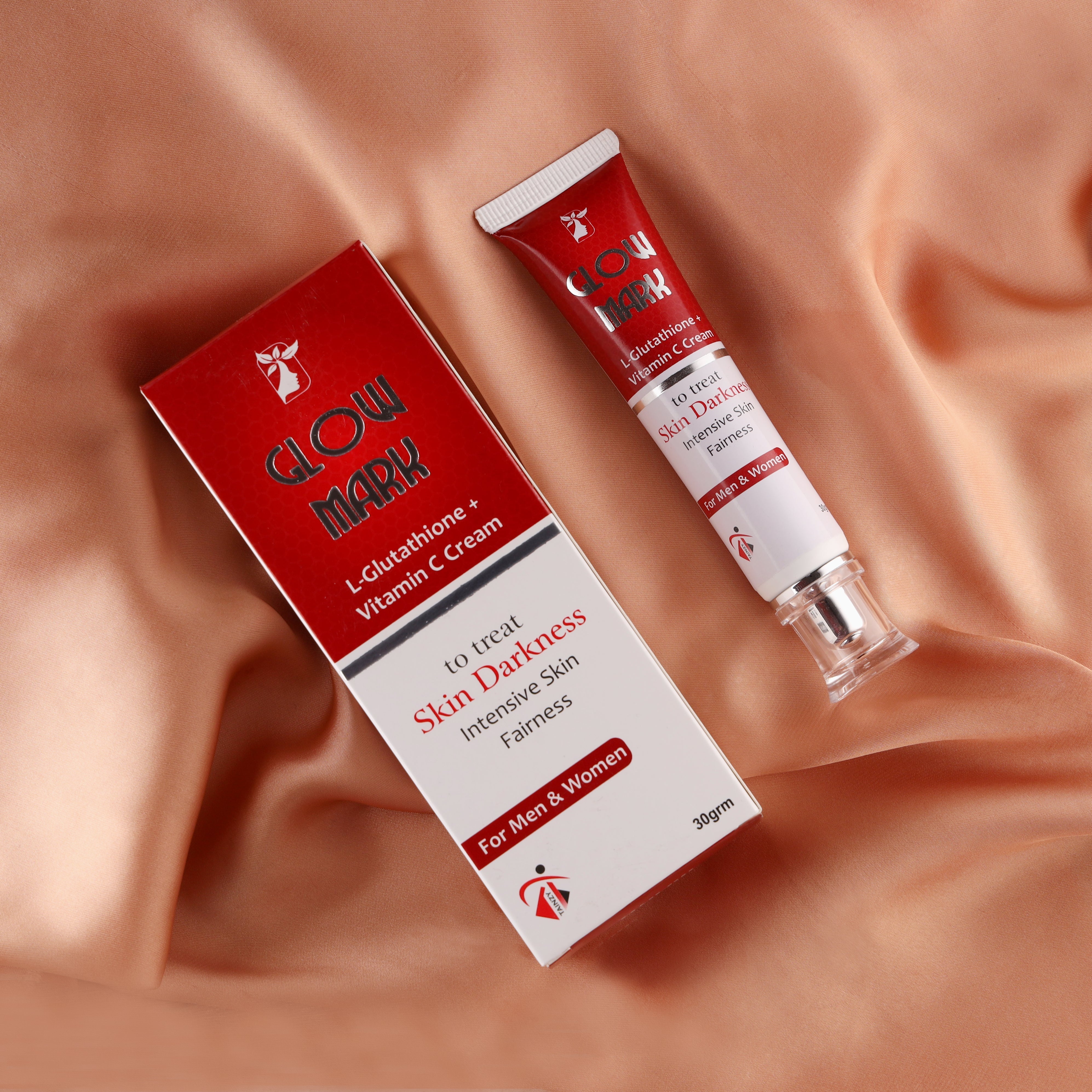 Glow Mark L-Glutathione and Vitamin C skin cream tube and box on satin fabric