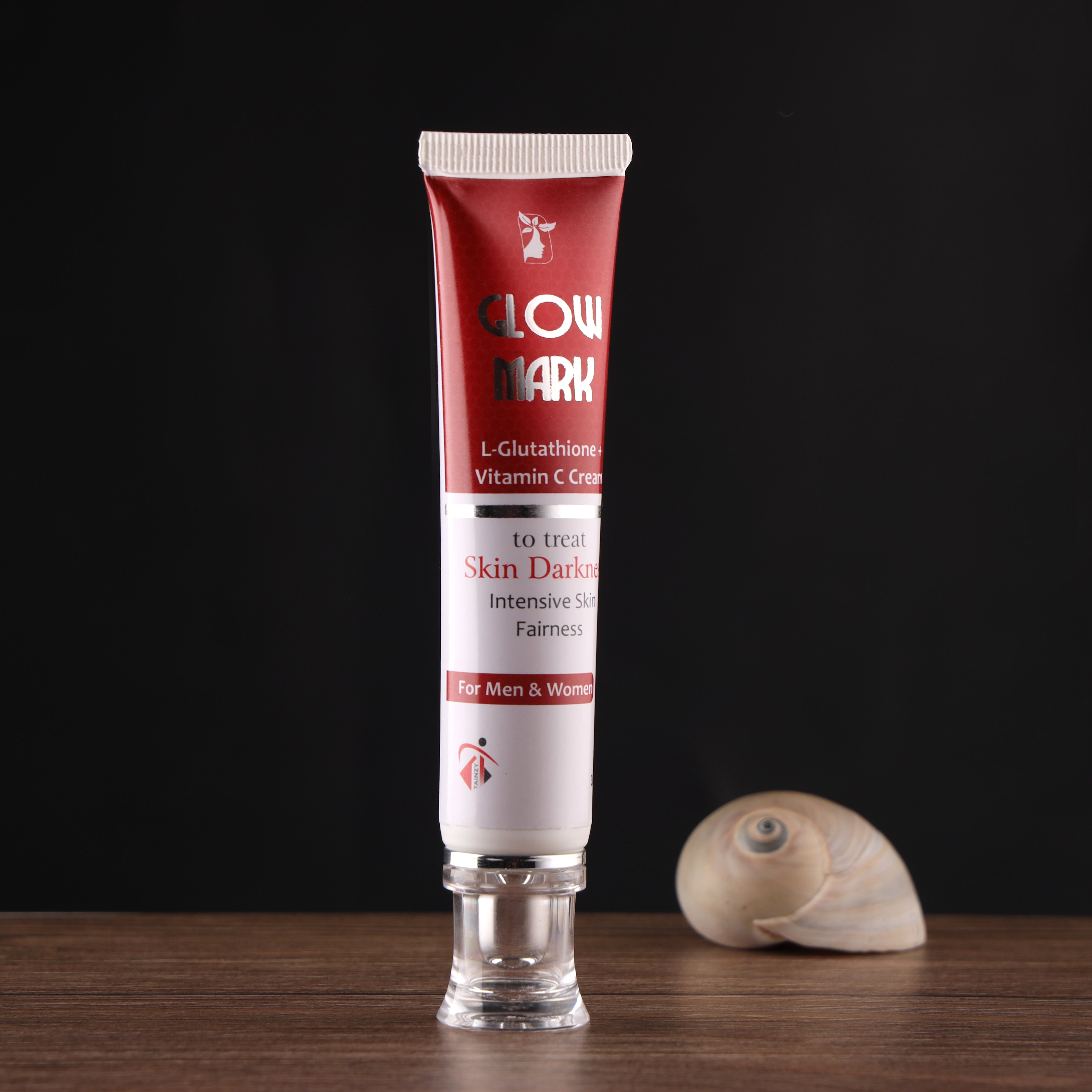 L-Glutathione and Vitamin C cream for skin dark spots on wooden table with black background