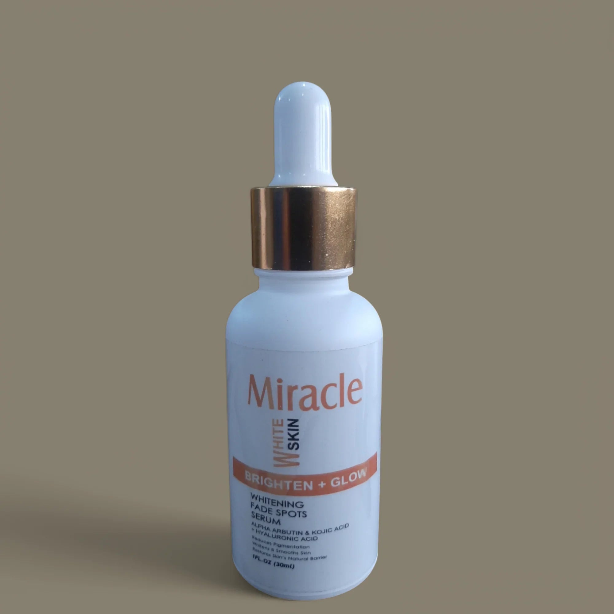 Miracle White Skin Brighten + Glow serum bottle with gold cap for skin brightening and spot fading