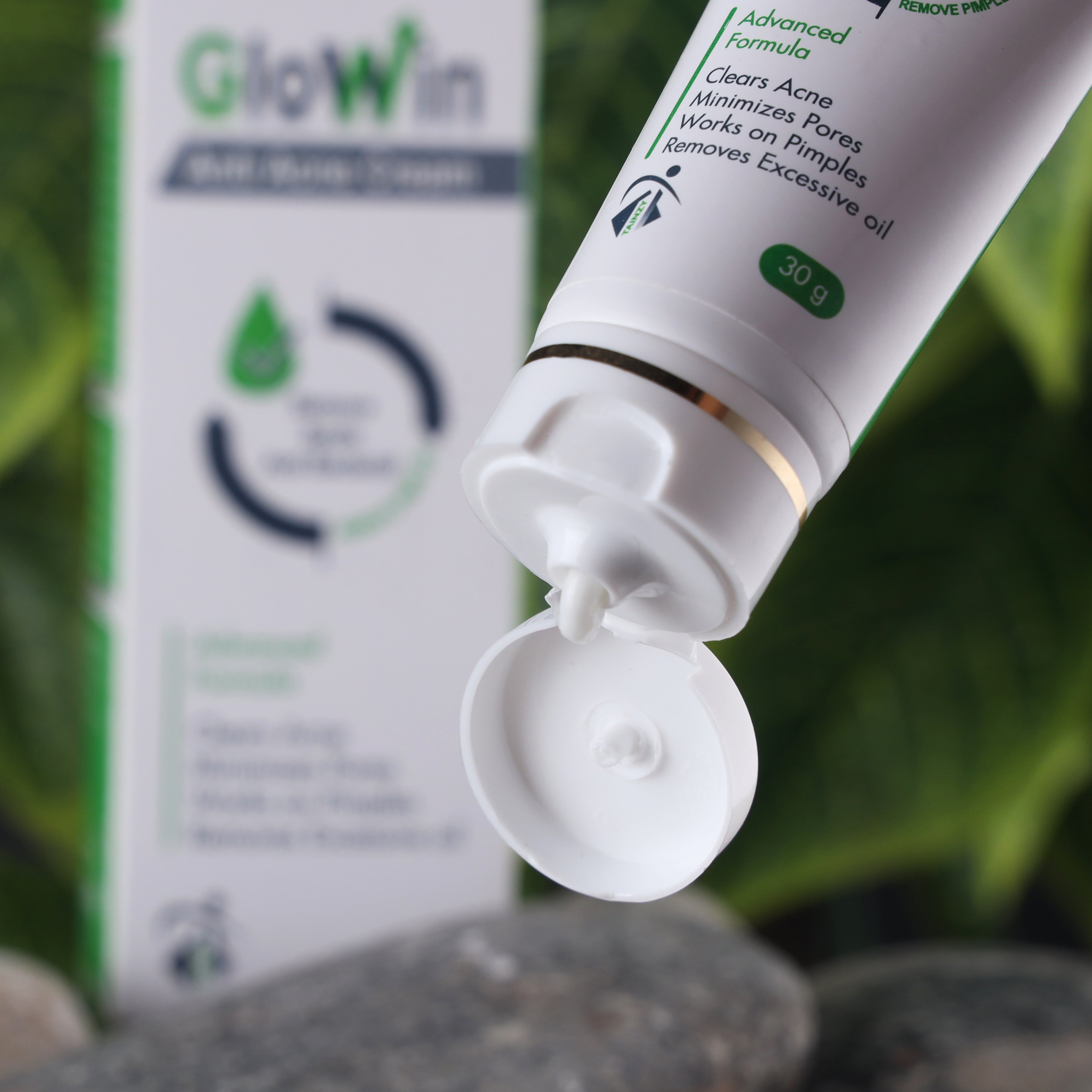 Anti-acne cream tube with open cap, focusing on skincare product for acne and pore care