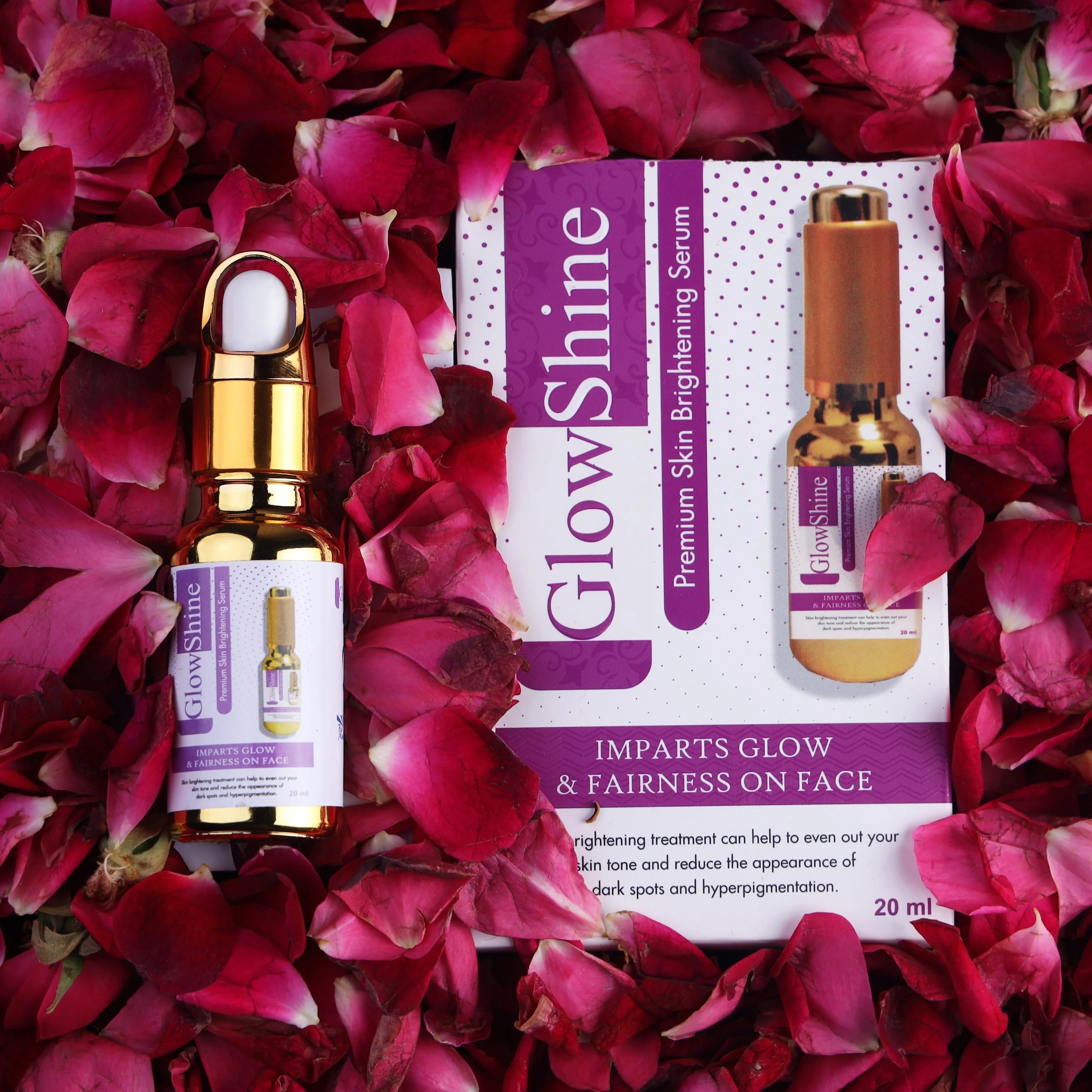 GlowShine skin brightening serum bottle and packaging on rose petals, skincare product