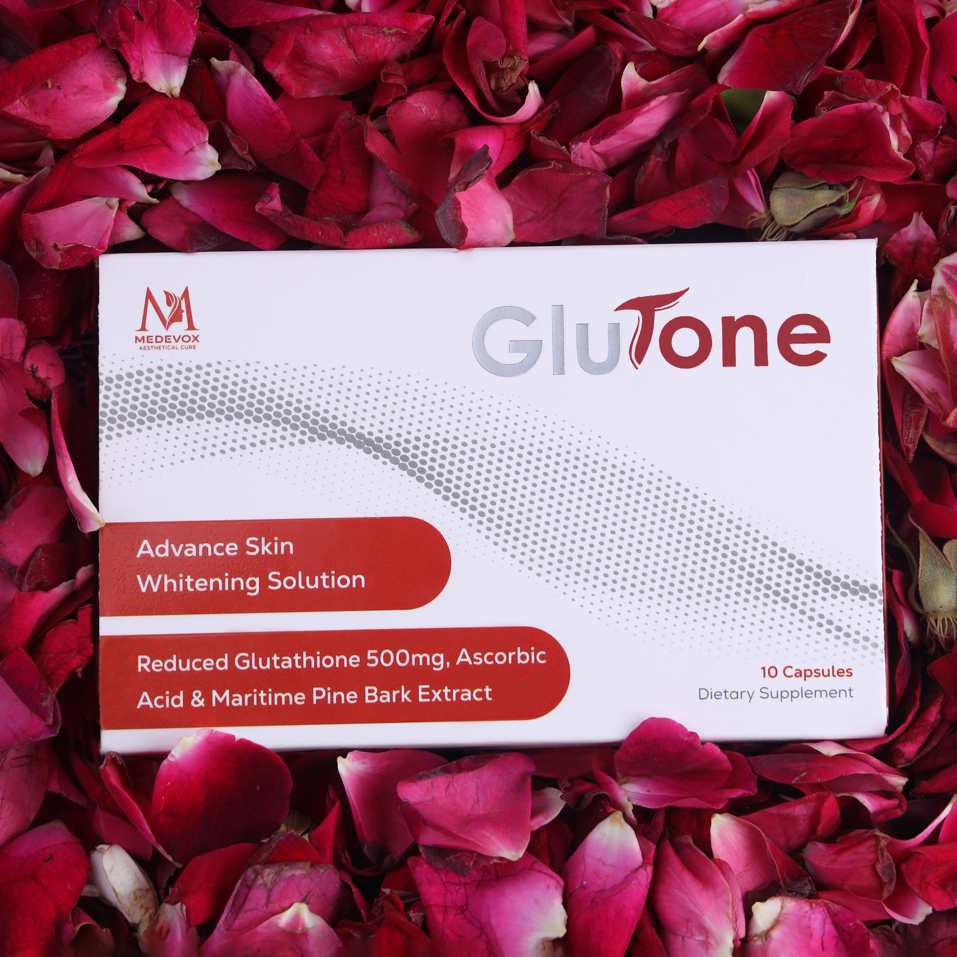 Glutathione skin whitening supplement box on rose petals, 10 capsules for brightening