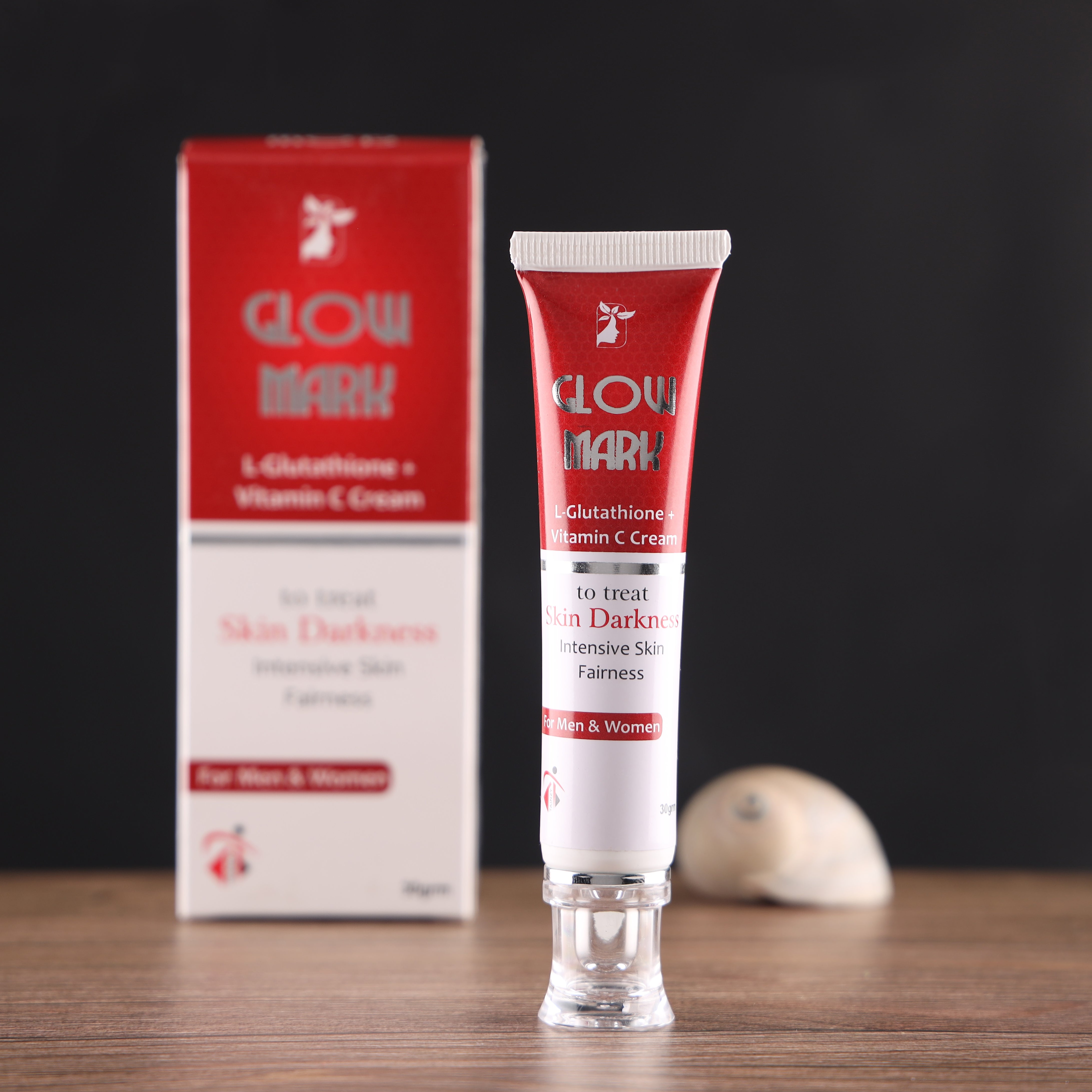 Glow Mark L-Glutathione Vitamin C Cream tube for skin darkness treatment on wooden table