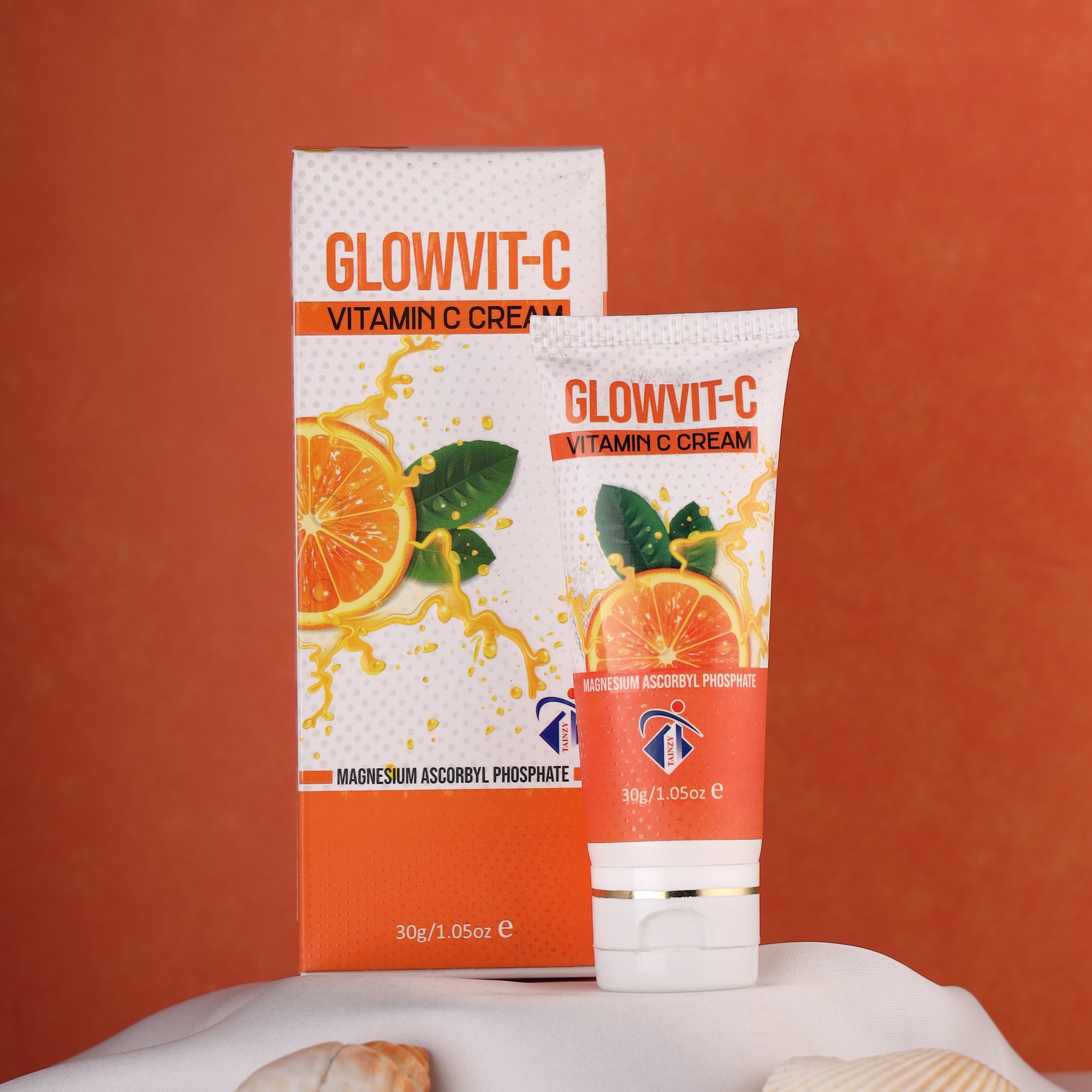 Glowvit-C Vitamin C Cream skincare product with orange slice design on tube and packaging